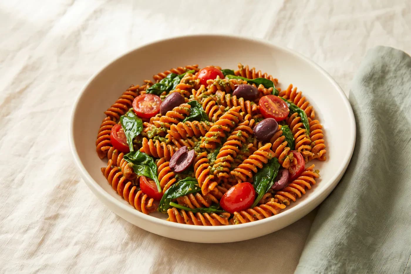 Pesto Red Lentil Pasta with Spinach and Olives